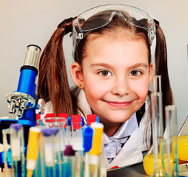 student with microscope and test tubes